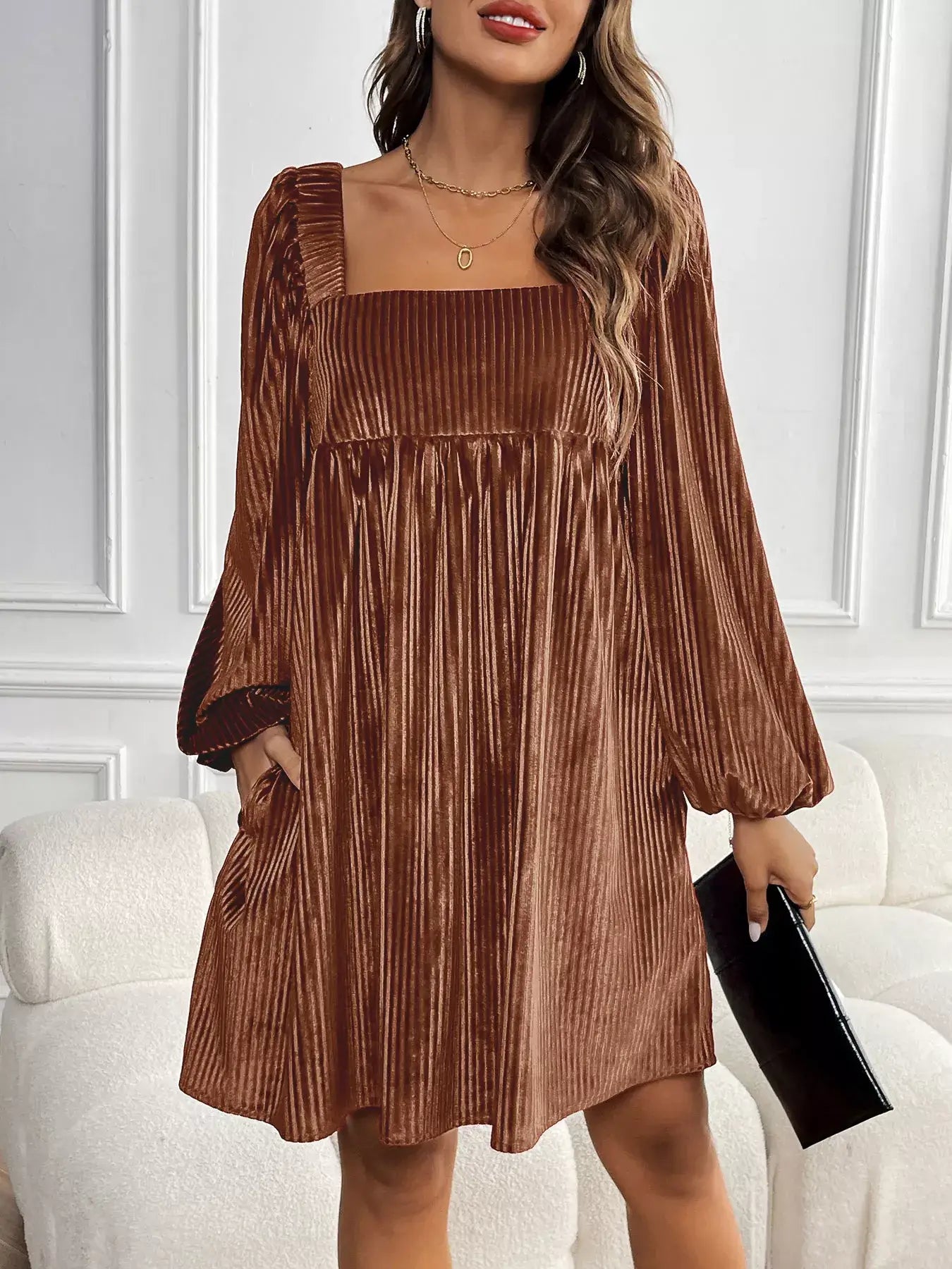 Model wearing a Velvet Square Neck Long Sleeve Dress in brown, showcasing the elegant design and luxurious velvet fabric.