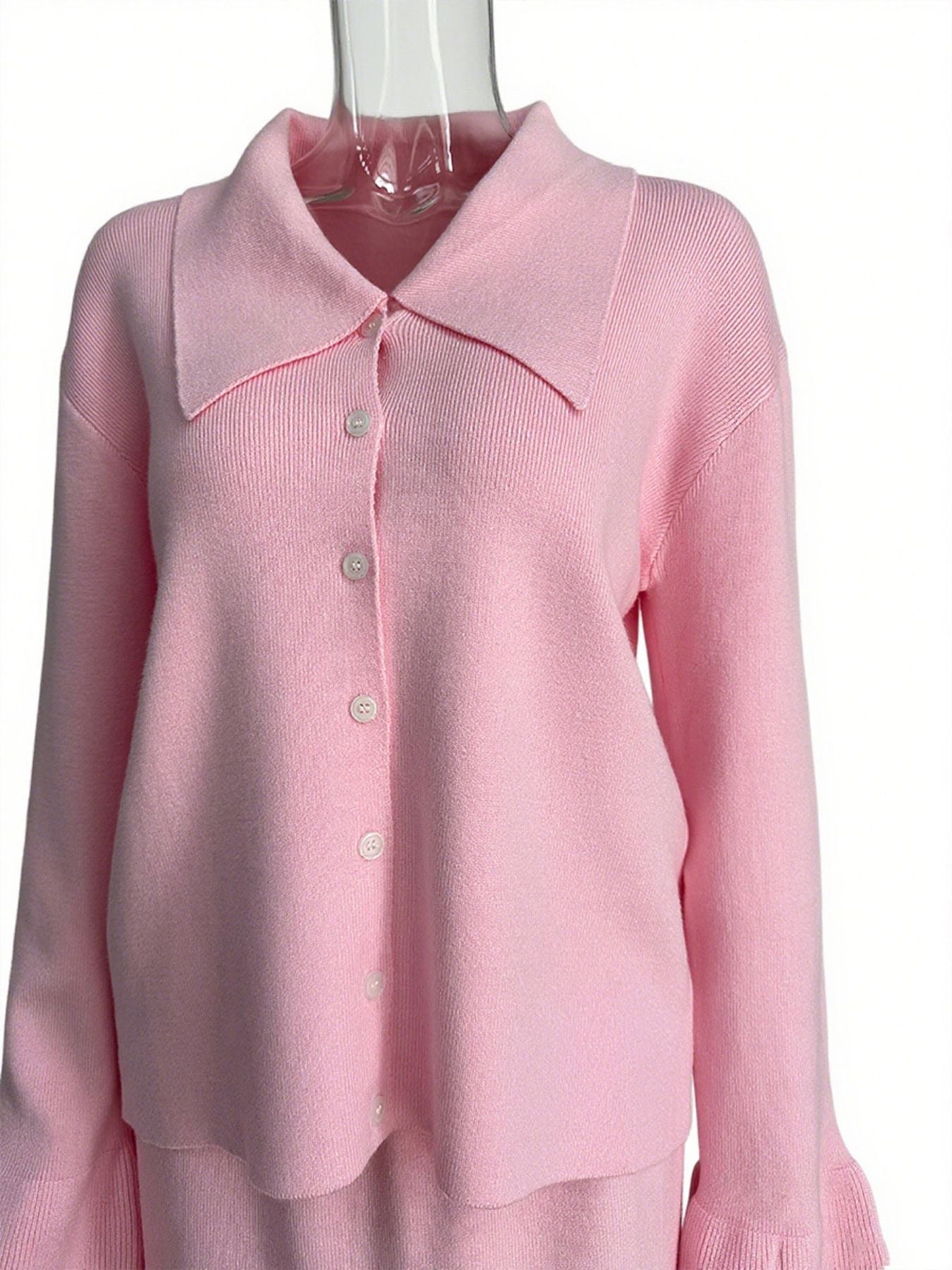 Button Down Cardigan and Skirt Knit Set in soft pink, featuring a ribbed texture and buttoned front.