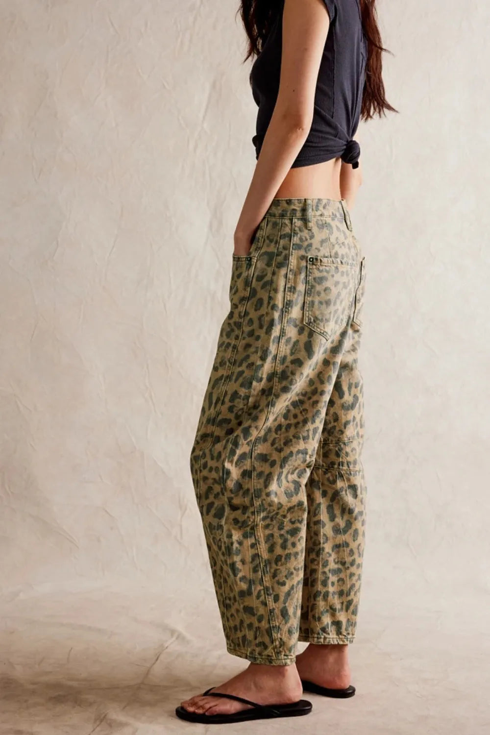Wide Leg Jeans with Pockets styled casually, featuring a relaxed fit and unique leopard print design.
