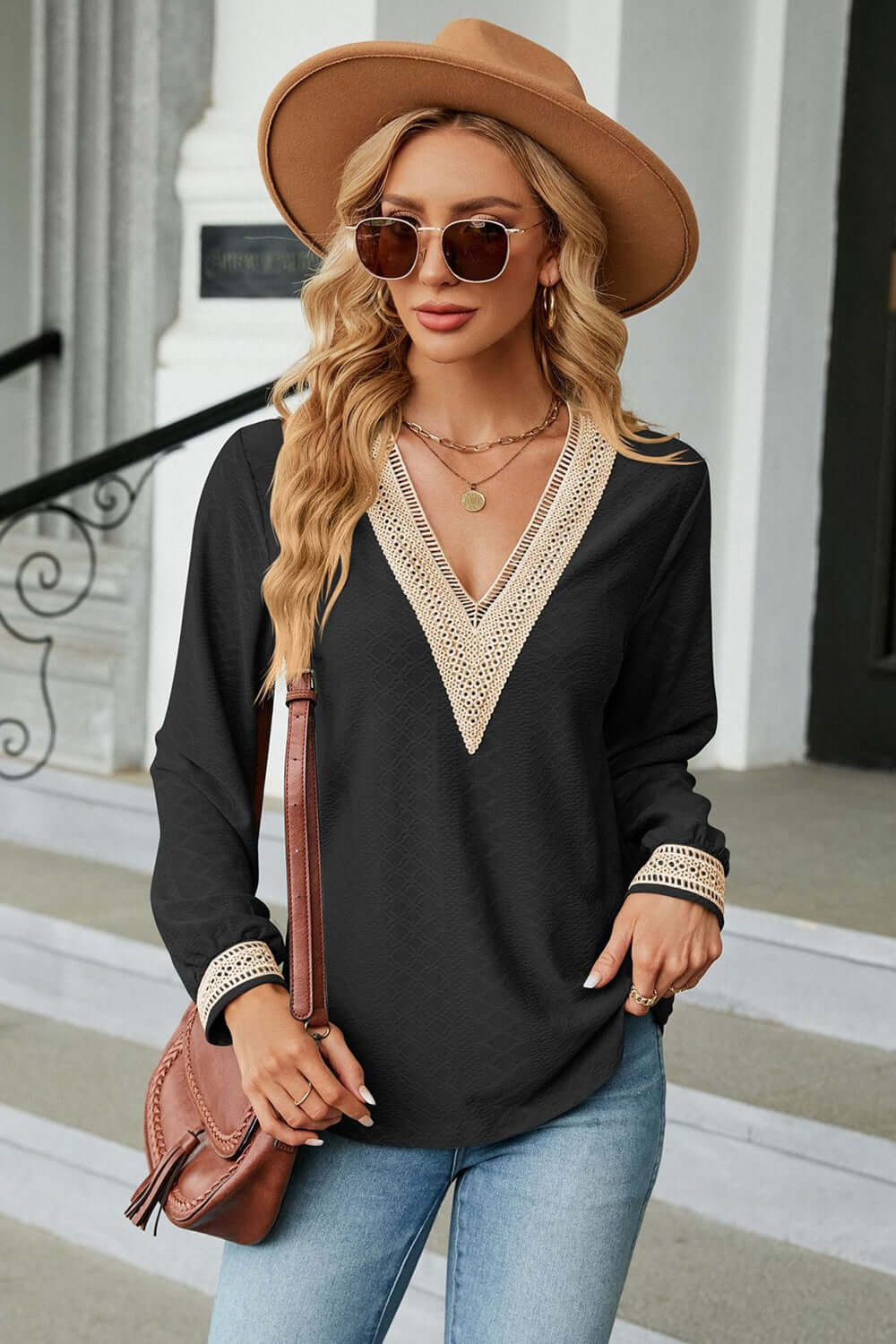 V-Neck Long Sleeve Blouse worn by a woman outdoors, styled with hat and sunglasses for a chic look.