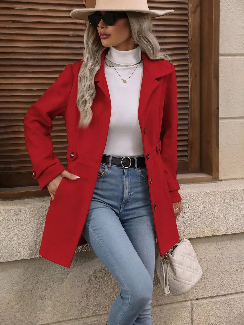 Collared Neck Button Up Coat in red paired with a white turtleneck and blue jeans, styled with accessories.
