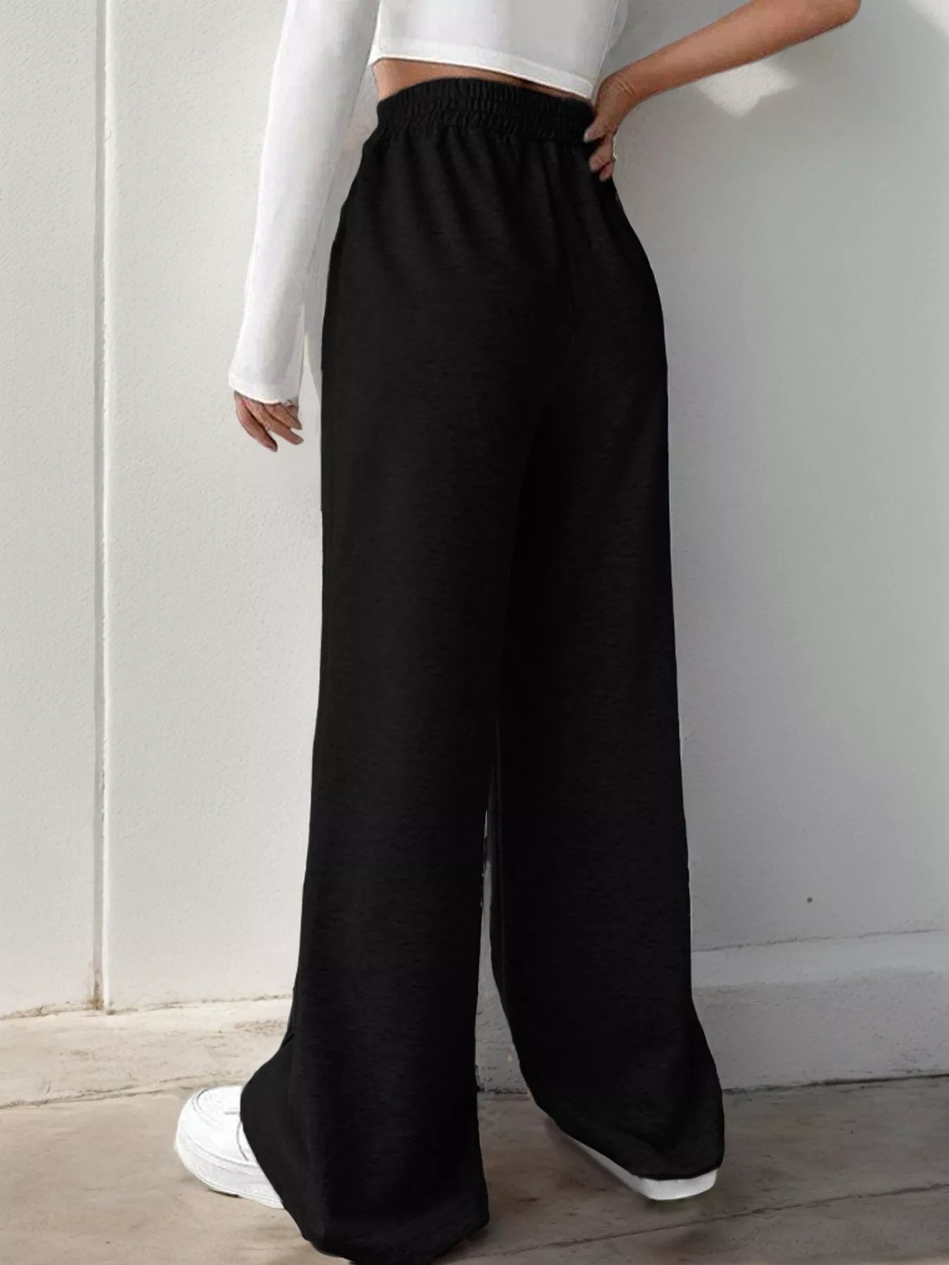 Wide Leg High Waist Pants in black, showcasing a relaxed fit and elegant style for everyday wear.