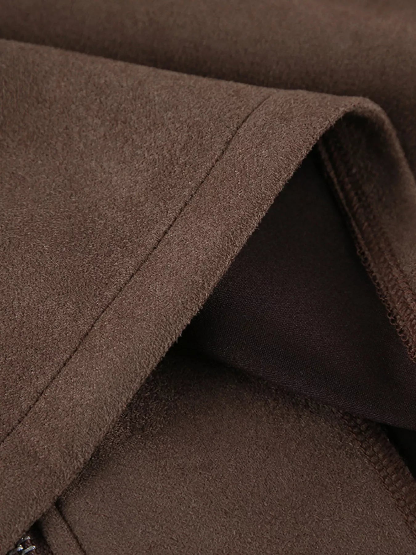 Close-up of the soft brown fabric texture of the Zip-Up Dropped Shoulder Jacket.