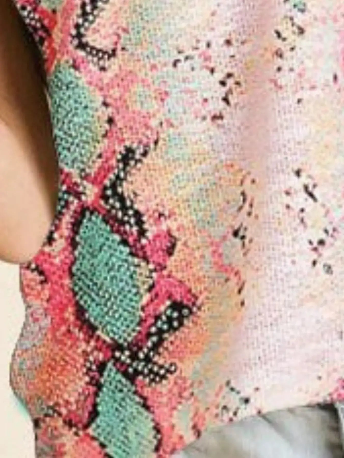 BiBi Snakeskin Low Gauge Sleeveless Top featuring vibrant snakeskin patterns in pink, green, and black.