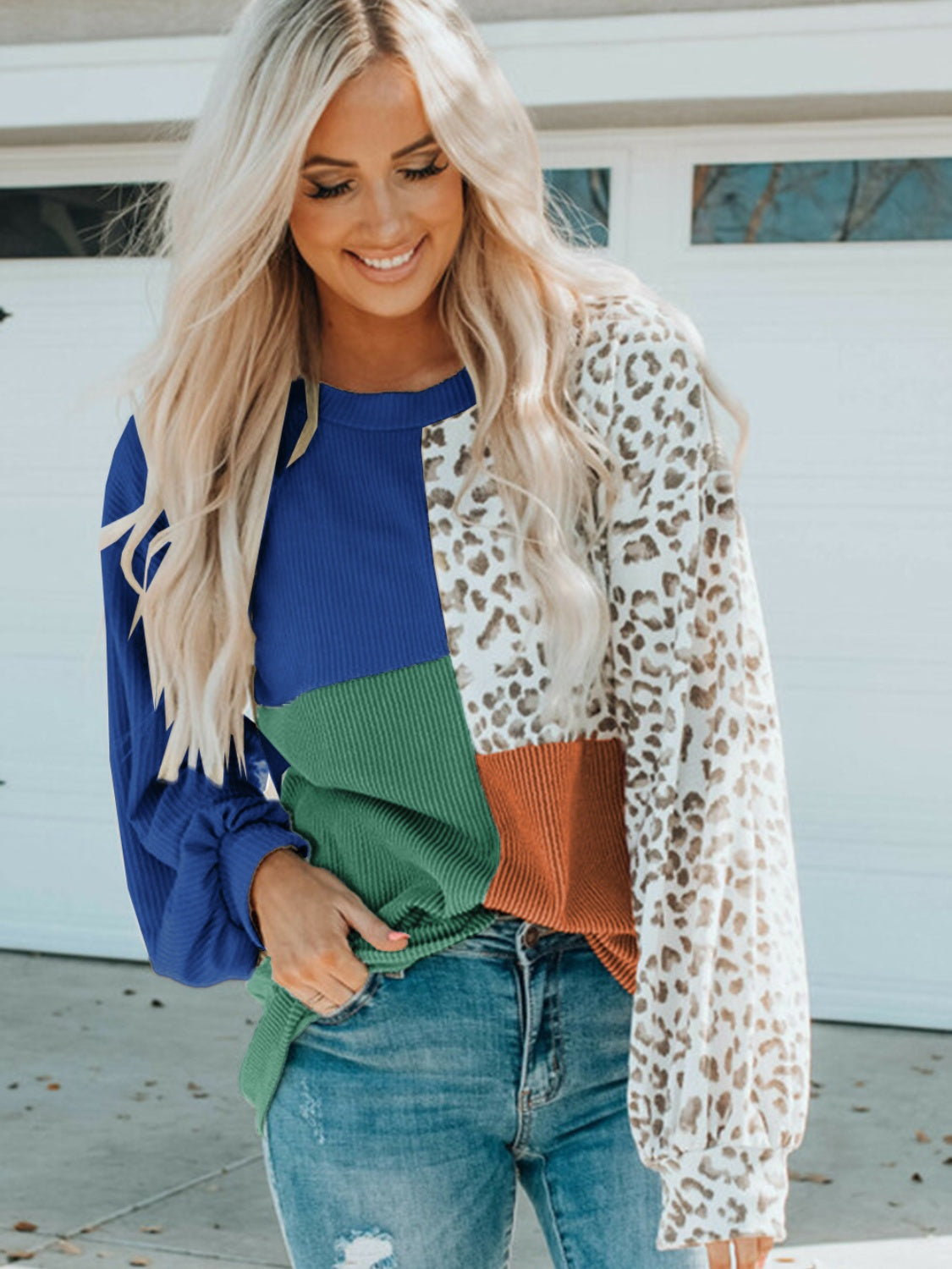 Color Block Leopard Round Neck Sweatshirt model wearing casual outfit with blue, green, and leopard print design.