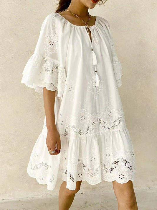Eyelet Embroidered Tassel Tie Neck Dress featuring ruffled sleeves and eyelet details in a stylish white cotton fabric.