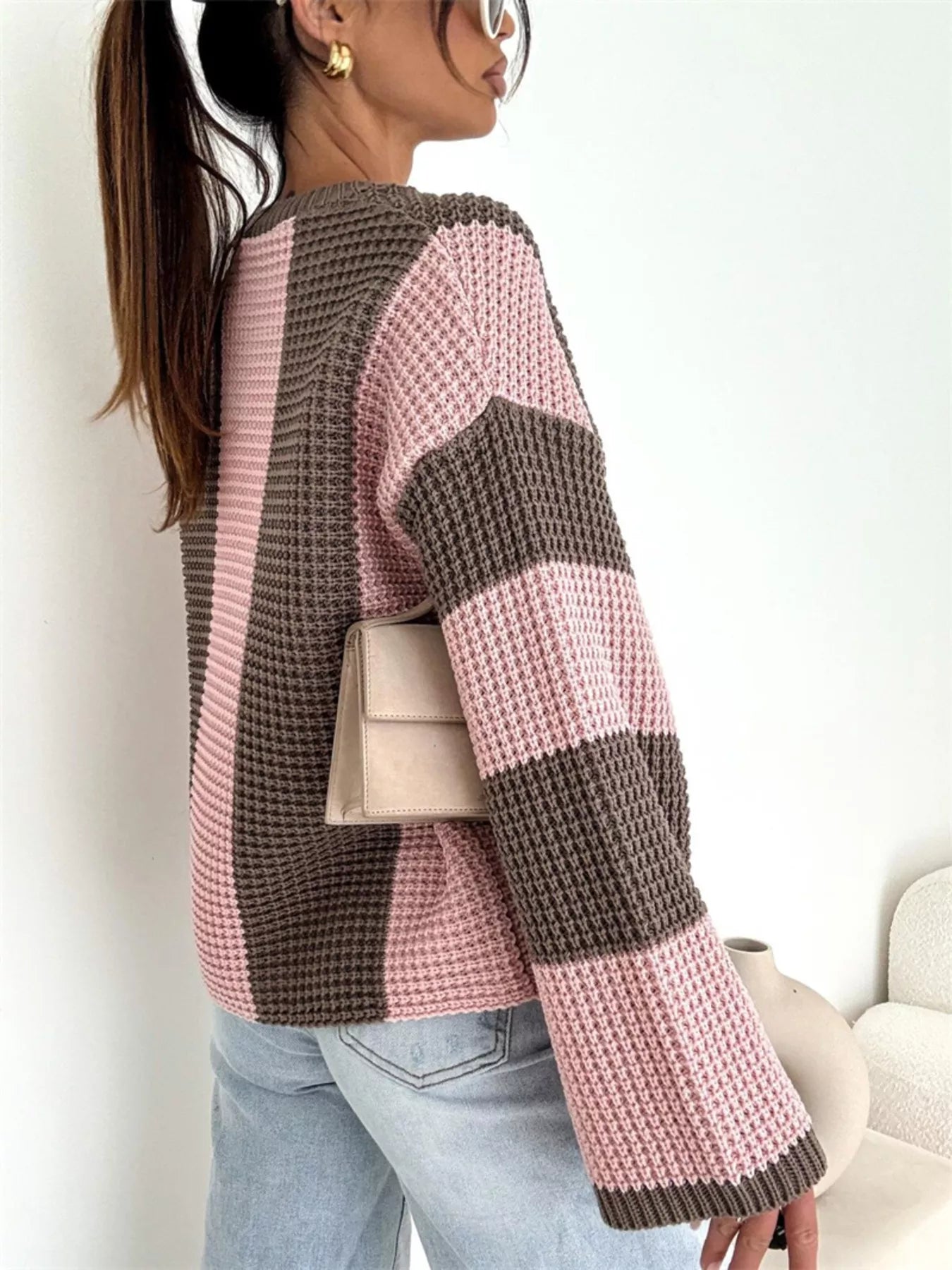 Model wearing a Color Block Long Sleeve Sweater in pink and brown, showcasing the oversized cozy knit style.