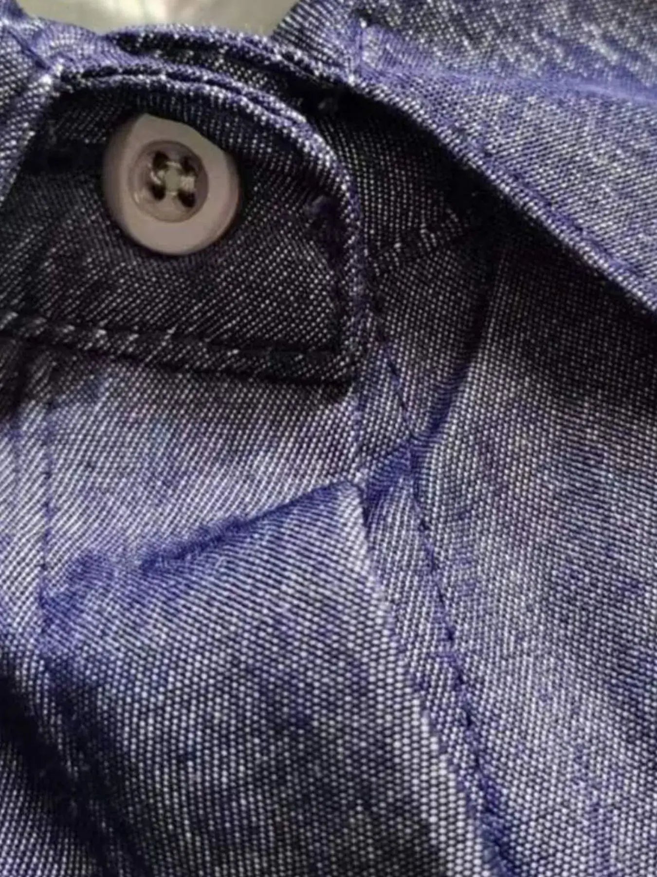Close-up of button and stitching on Full Size Button-Down Maxi Denim Dress, showcasing quality denim fabric.