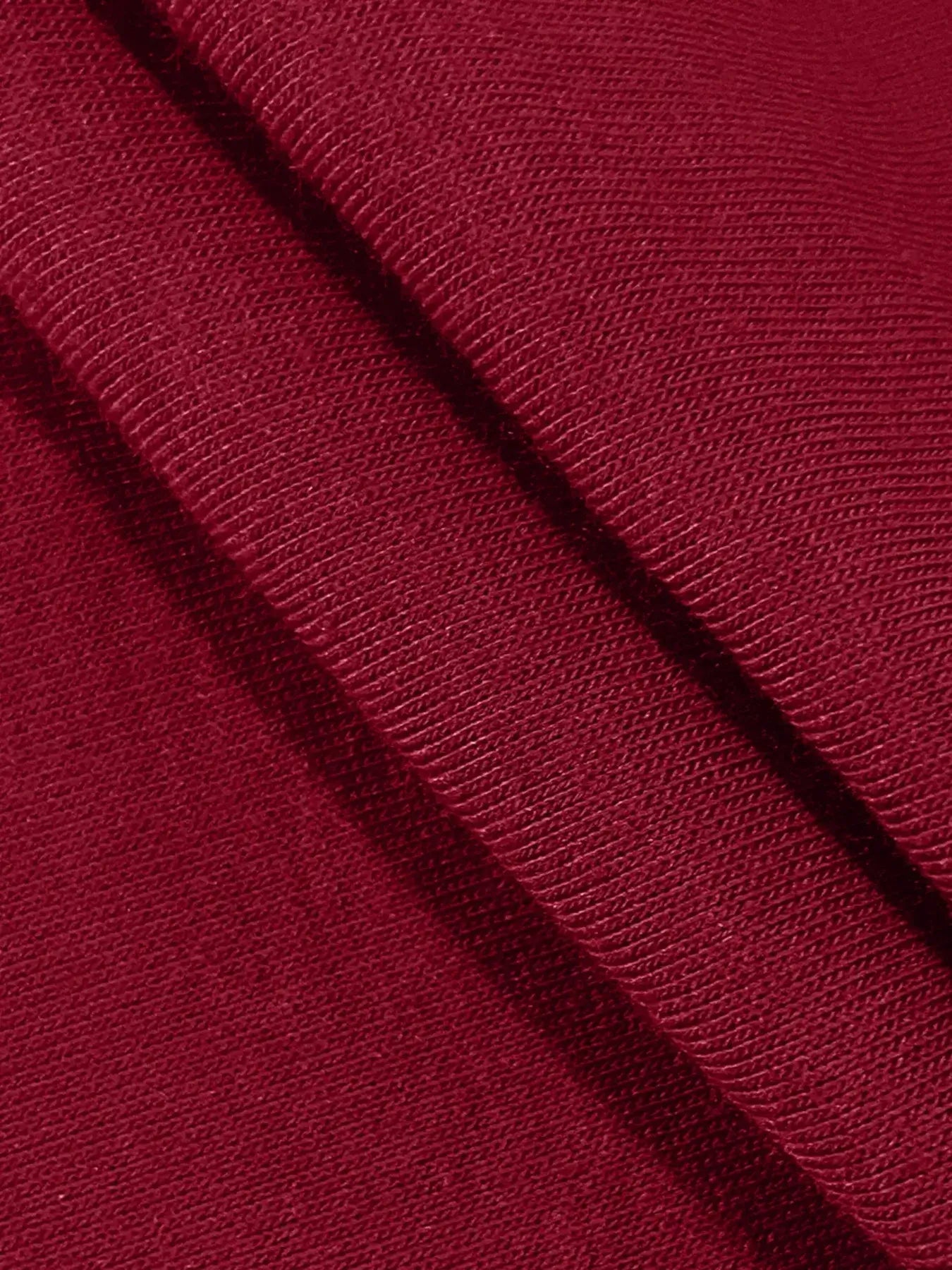 Close-up of soft, rich burgundy fabric texture for Long Sleeve Drawstring Romper.