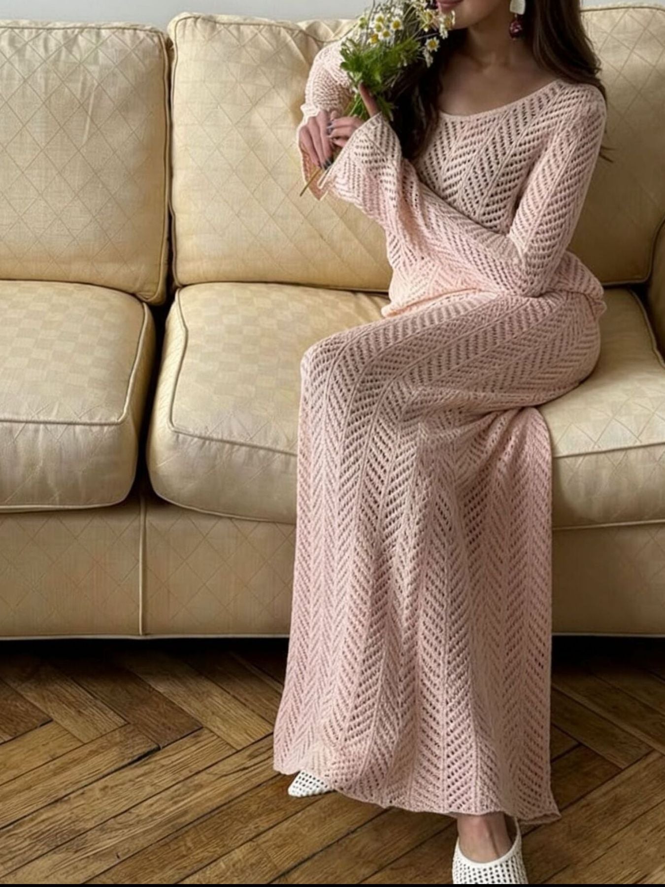 Openwork Long Sleeve Knit Top and Skirt Set elegant women outfit with floral accent on a couch