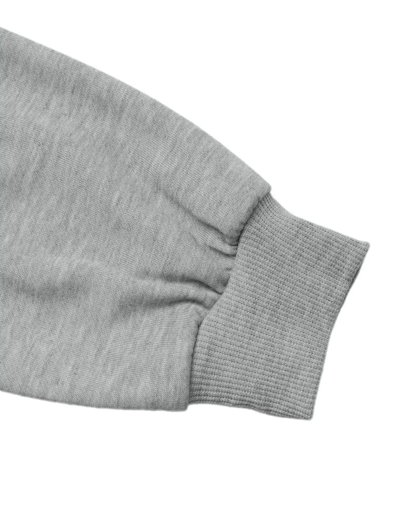 Close-up of the sleeve cuff of the Bow Detail Round Neck Sweatshirt in grey fabric.