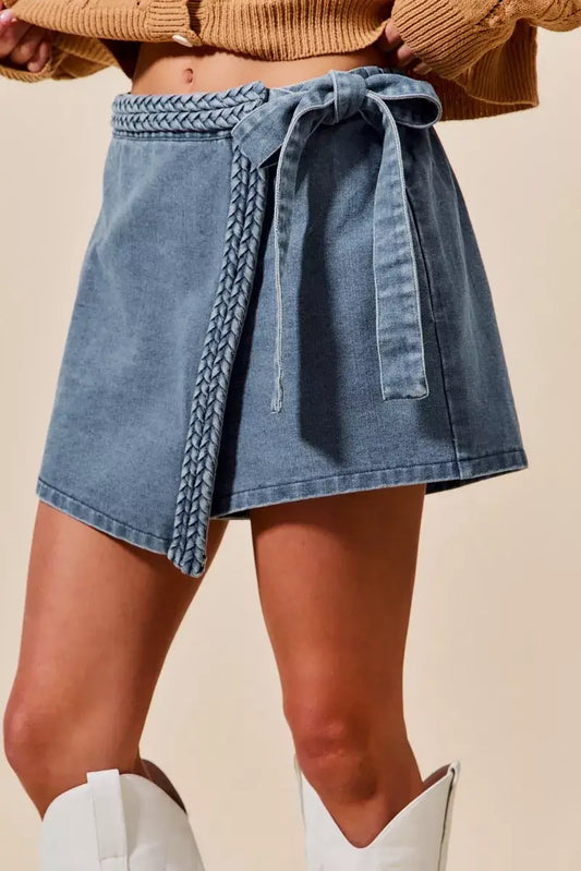 Wrap braided trimmed denim skort for women with a chic tie detail, showcasing a blend of style and comfort.