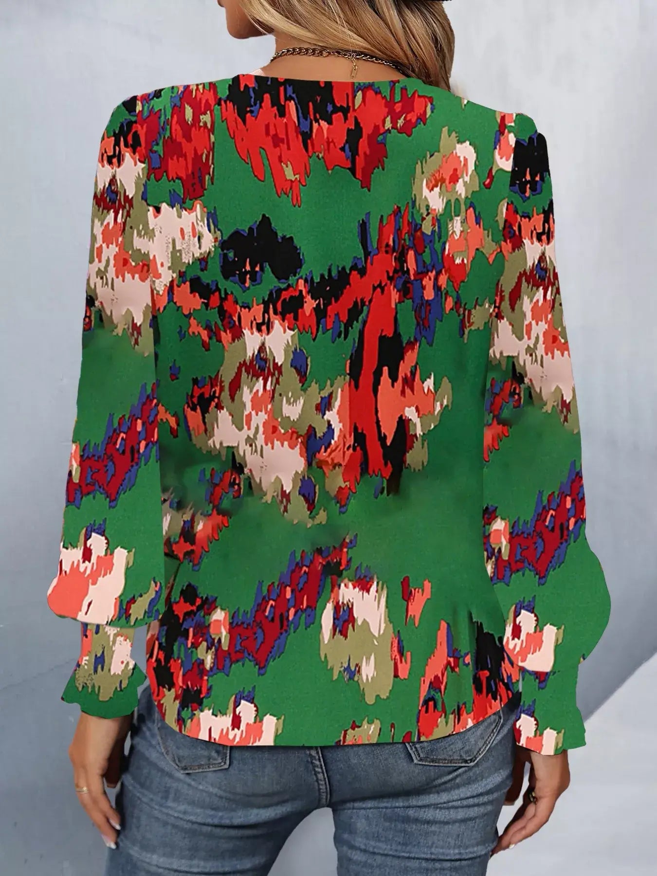 Back view of a printed button up long sleeve shirt in vibrant colors, perfect for casual and smart occasions.