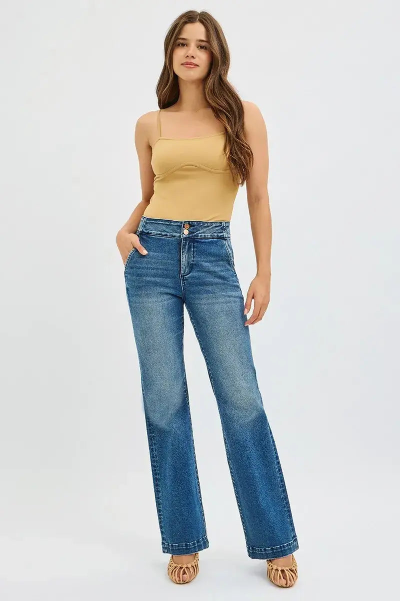 Model wearing RISEN High Rise Bootcut Jeans Plus Size with double button waistband, showcasing comfortable and stylish fit.