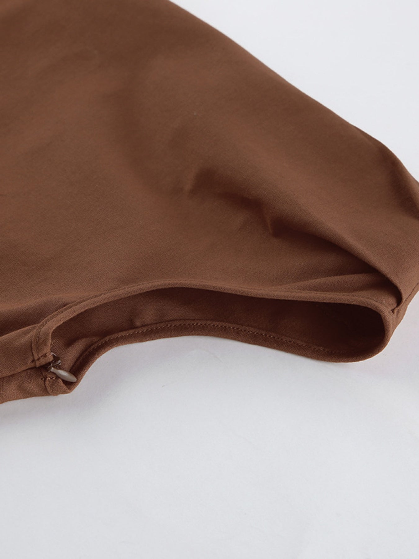 Detail of One Shoulder Top and Shorts Set showing the smooth fabric and stitching, perfect for a stylish outfit.
