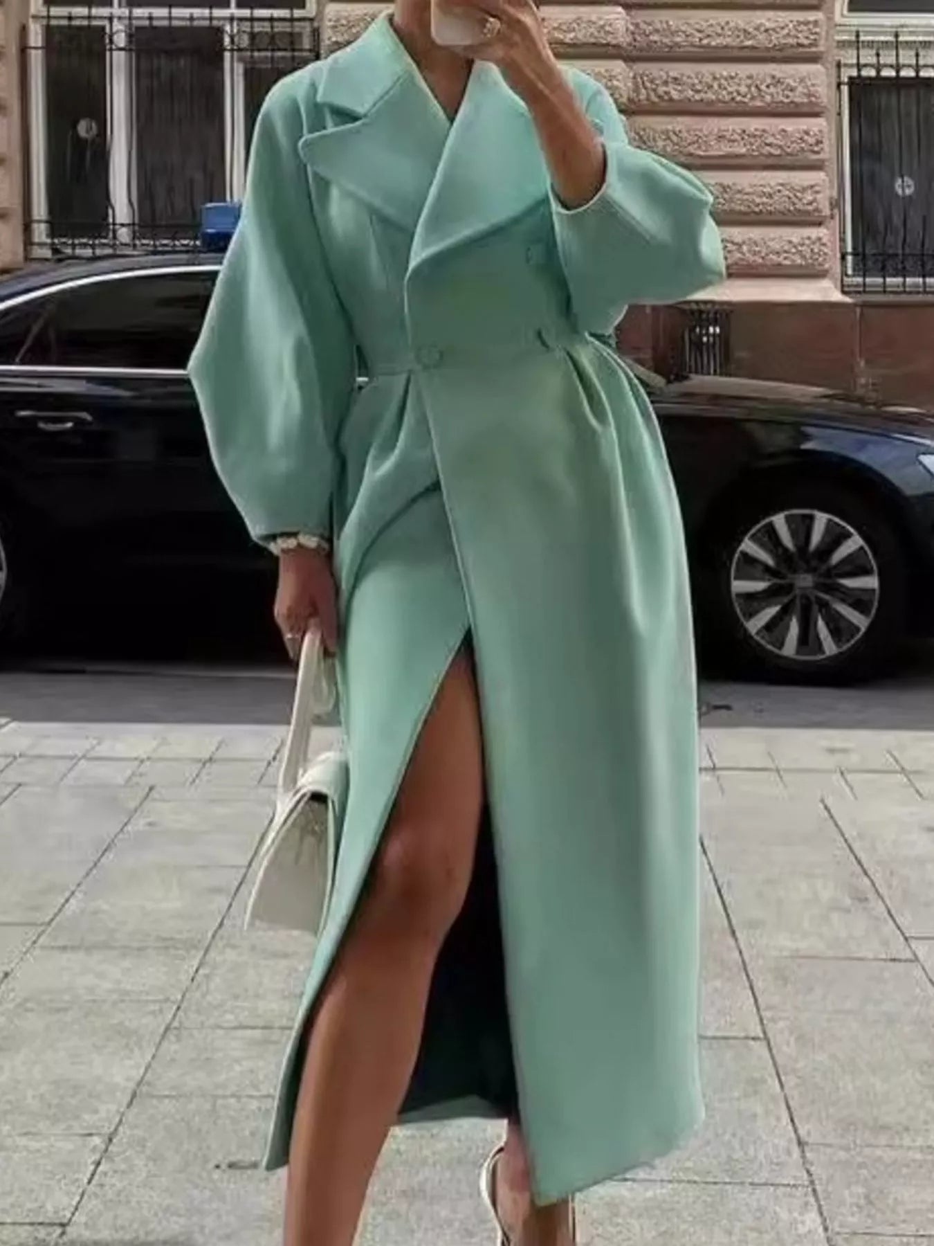 Double-Breasted Longline Coat in mint green with elegant tailored silhouette and side slit.