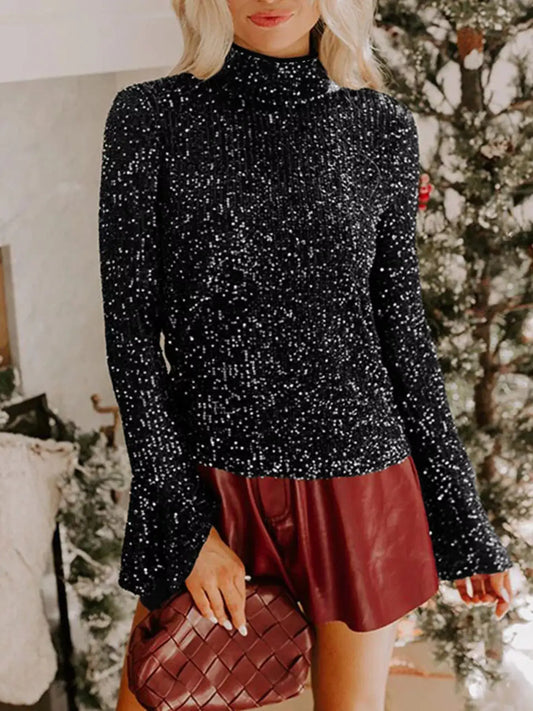 Sequin Mock Neck Drape Open Back Bell Sleeve Top worn with stylish burgundy shorts in a festive setting.