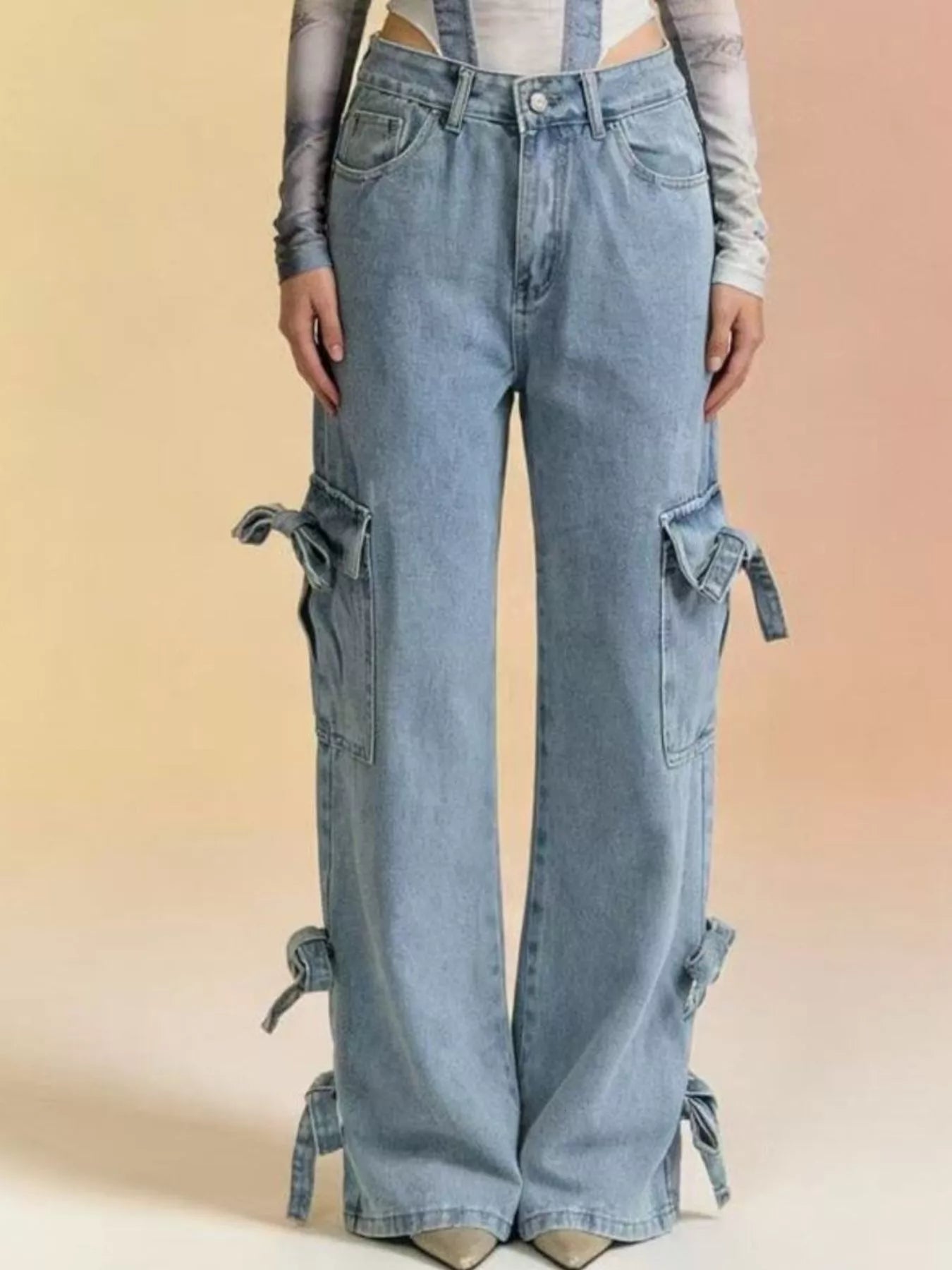 Bow Wide Leg Jeans with pocketed detail and relaxed fit, featuring tie embellishments.
